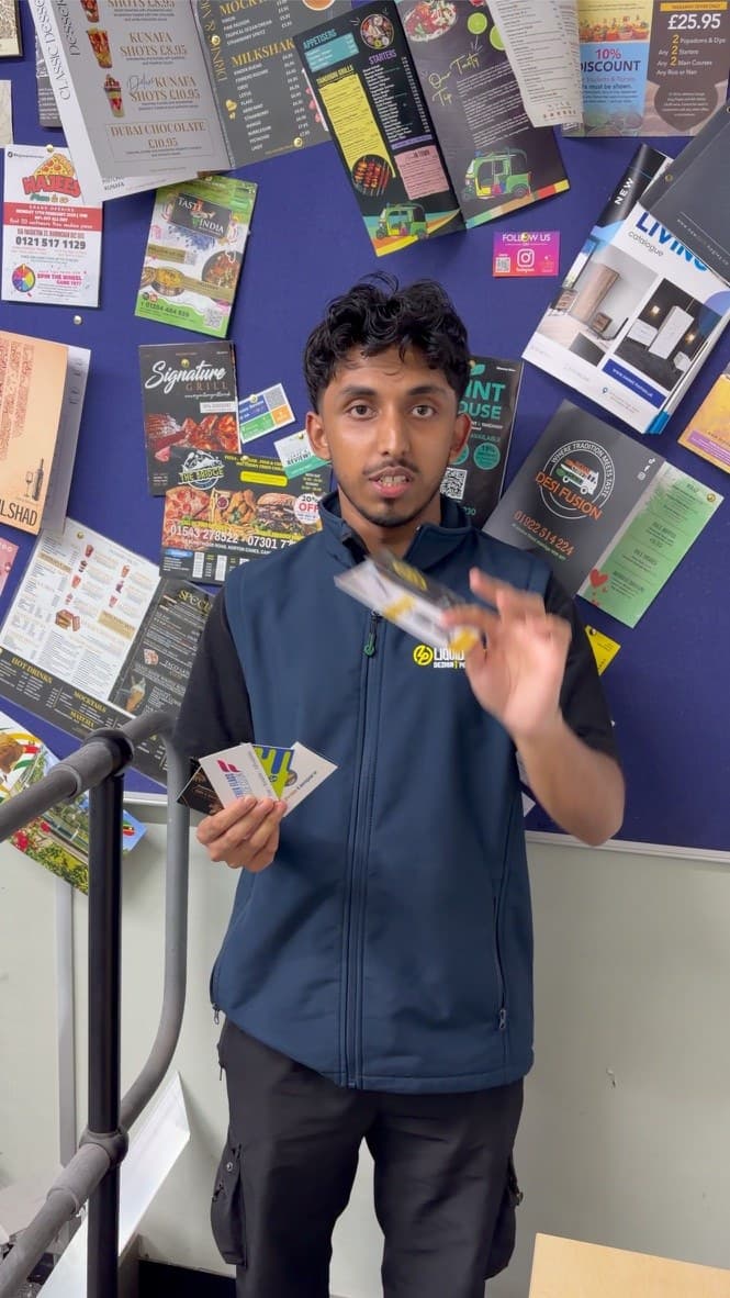 Liquid Print team member presenting print samples during a Beam Media shoot